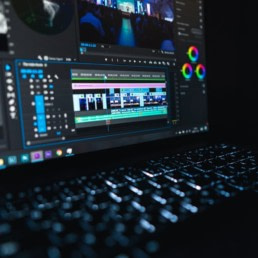Video editing software being used to produce a business marketing video.